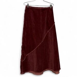 Cotélac burgundy velvet maxi skirt with asymmetrical hem detail and frayed edges